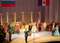 Торжественное открытие Государственного русского драматического театра Удмуртии в г. Ижевске, после капитального ремонта. На сцене театра участников открытия приветствует Президент УР Волков Александр Александрович (в центре). На заднем плане артисты театра